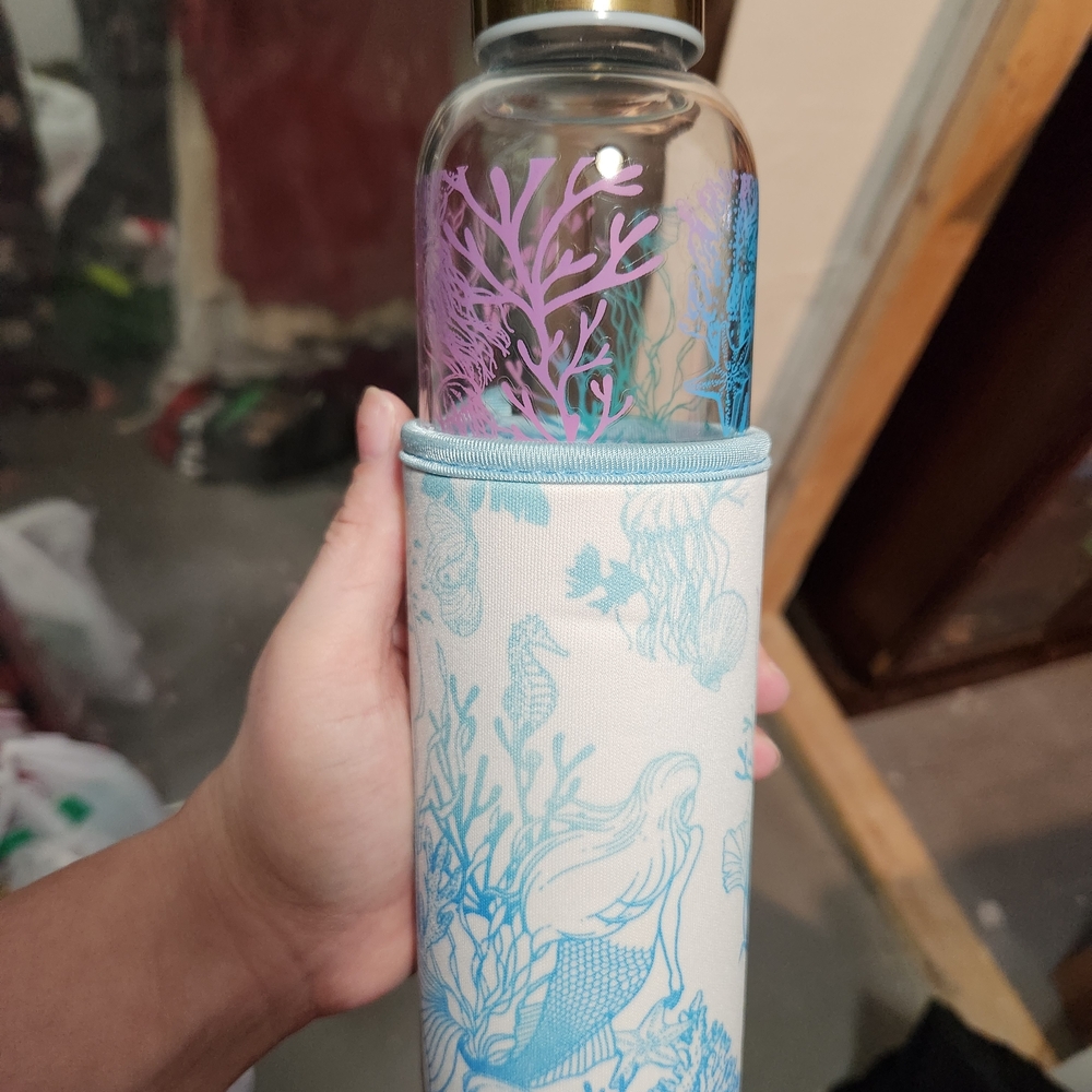 Icing Coral Design Glass Bottle with Blue Sleeve